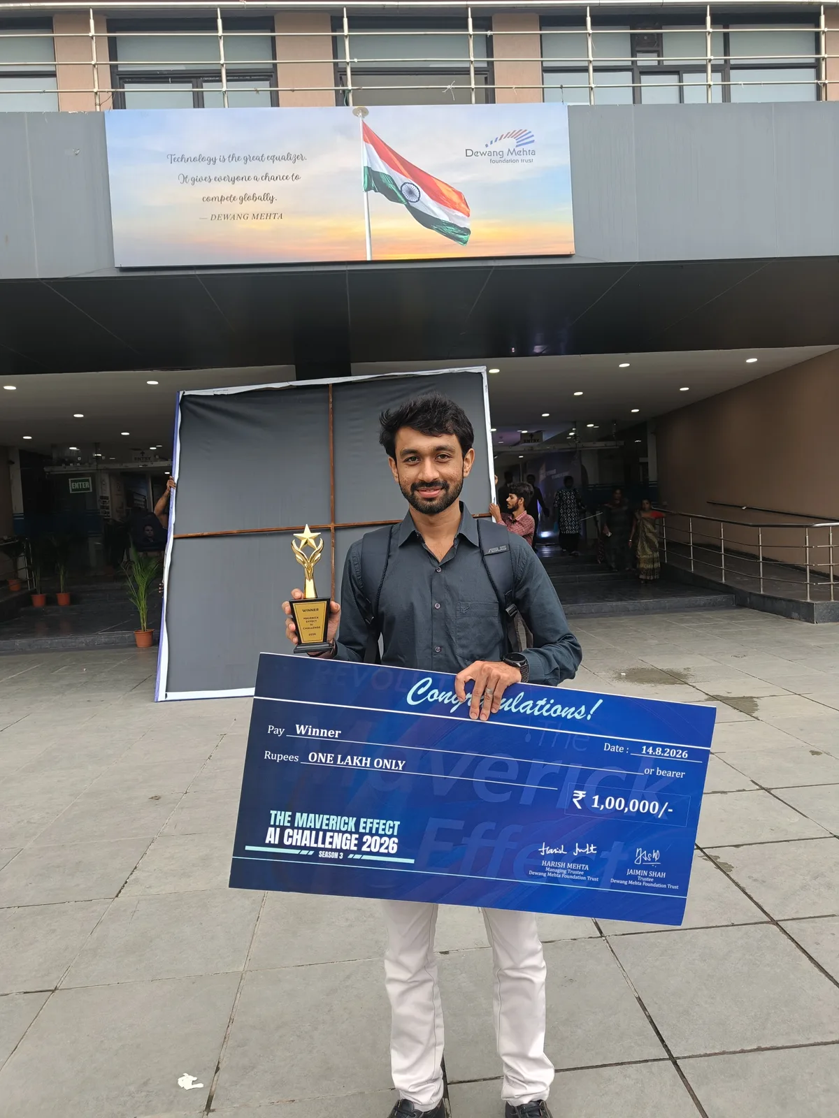 Vatsal Mehta holding the winner's trophy and cheque at The Maverick Effect AI Challenge 2026