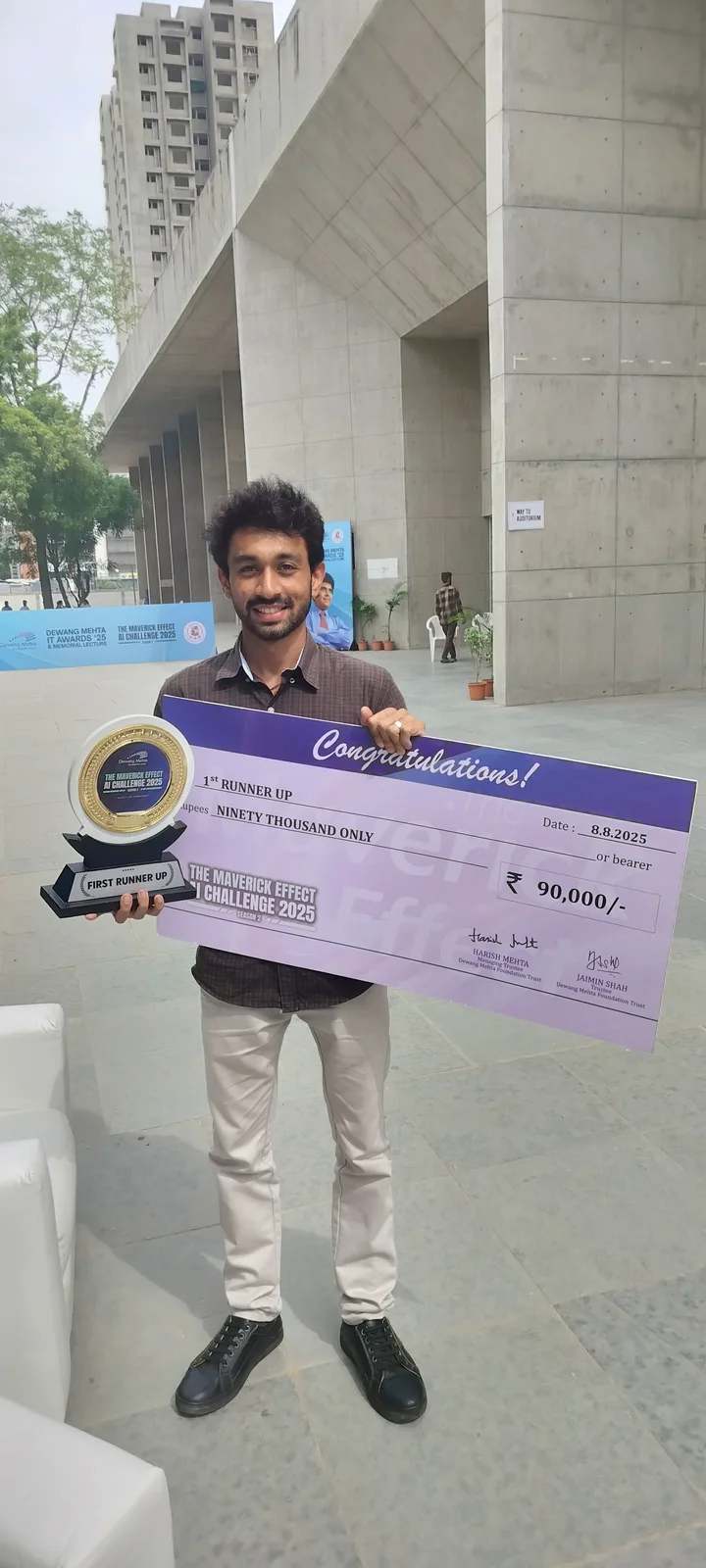 Vatsal Mehta with the first runner-up trophy and cheque at The Maverick Effect AI Challenge 2025