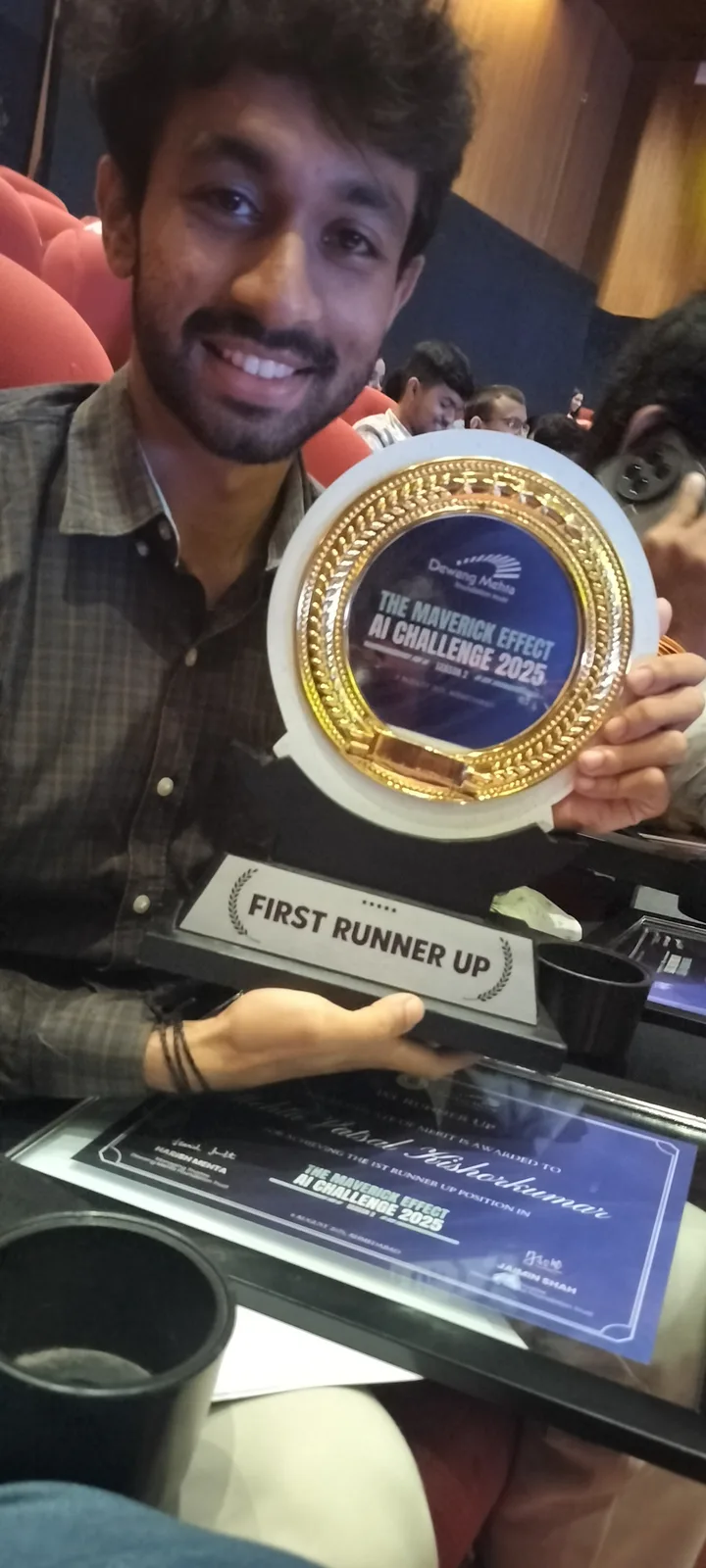 Vatsal Mehta with the first runner-up trophy at The Maverick Effect AI Challenge 2025